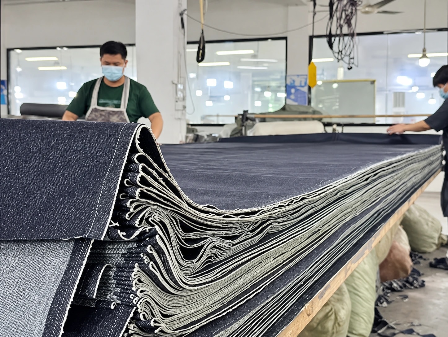 Fabric preparation at the company’s facility, AI-enhanced from a supplied photograph
